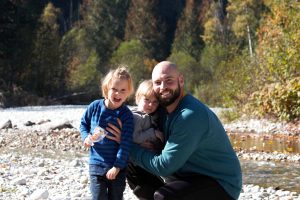 Drew with his kids after moving to Revelstoke.